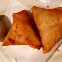 Meat Samosa · Crisp patties filled with mildly spiced chicken meat.