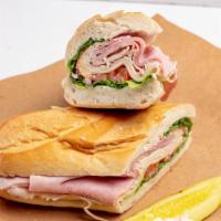 The Club · Ham, turkey, Swiss, lettuce, tomato, onions, vinegar, and oil. Served with pickle and side o...