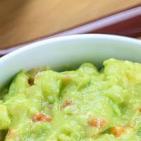 Homemade Guacamole And Chips · Avocado, cilantro, onions, tomato, lime salt and pepper.