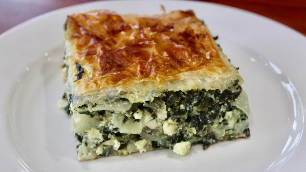 Spinach Pie · Phyllo dough, fresh spinach, scallions, onions, dill, and feta cheese.