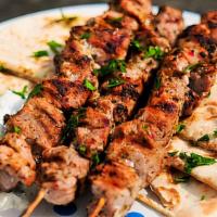 Pork Souvlaki (1 Pc) · Marinated pork, garlic, onions, black pepper, lemon juice, oregano, olive oil & vinegar