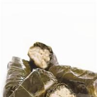 Dolmades (6 Pieces) · Stuffed grape leaves filled with rice and herbs and lemon