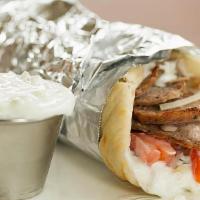 Lamb Gyro · Greek traditional pita served with red onion, tomato, lettuce, french fries wrapped in warm ...