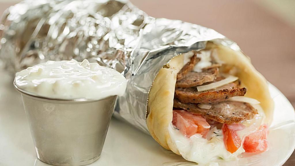 Lamb Gyro · Greek traditional pita served with red onion, tomato, lettuce, french fries wrapped in warm pita. Your choice of pita bread and sauce.