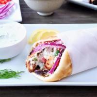 Chicken Gyro · Greek traditional pita served with red onion, tomato, lettuce, french fries wrapped in warm ...