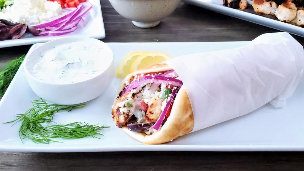 Chicken Gyro · Greek traditional pita served with red onion, tomato, lettuce, french fries wrapped in warm pita. Your choice of pita bread and sauce.