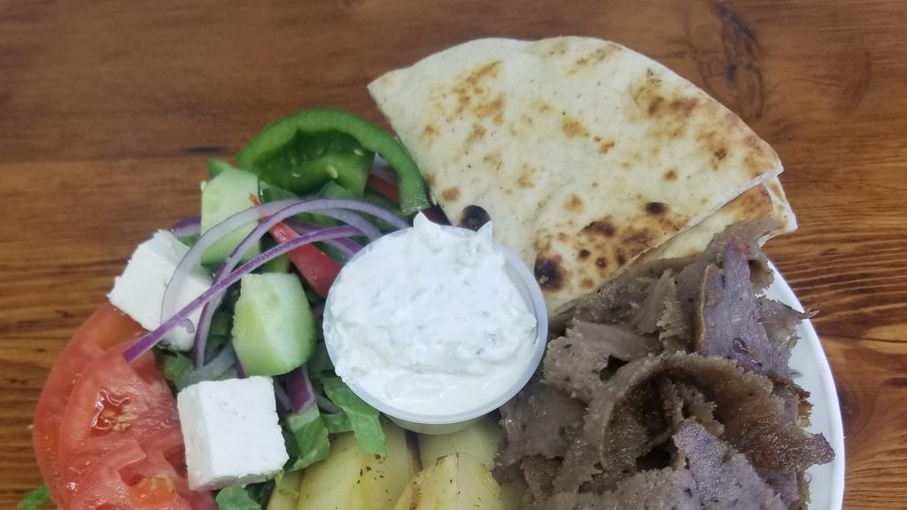 Lamb Gyro Platter  · Served with Greek salad and your choice of pita, lemon potatoes,rice,fries,or roasted vegetable.