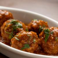 Albondigas · Pork and beef meatballs in a light tomato sauce.