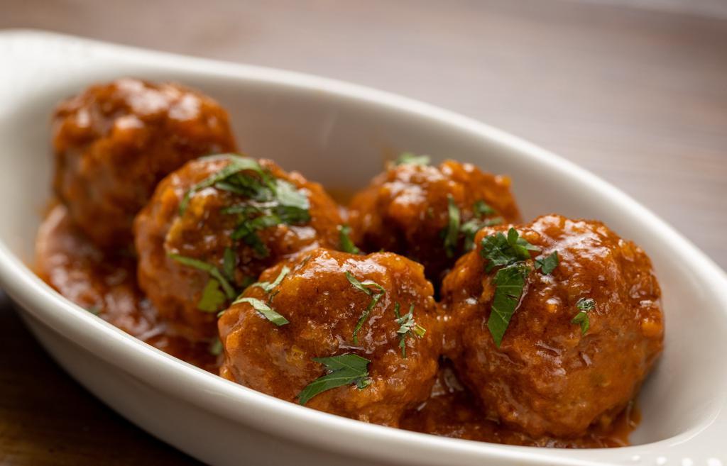 Albondigas · Pork and beef meatballs in a light tomato sauce.