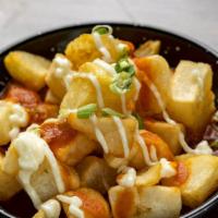 Patatas Bravas · Crispy potatoe, garlic aioli, spicy tomato sauce, scallions.