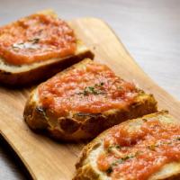 Pan Con Tomate · Fresh tomatoes Spread with olive oils, garlic on fresh country bread.