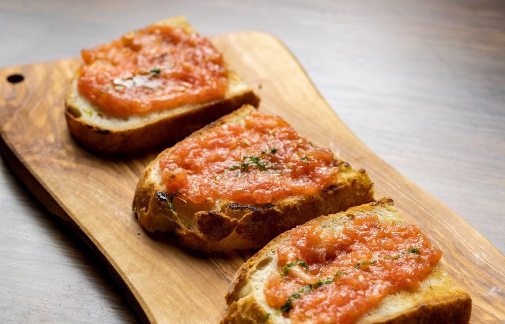 Pan Con Tomate · Fresh tomatoes Spread with olive oils, garlic on fresh country bread.