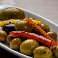 Olivas · Homemade marinated olive with spice and olive oil.
