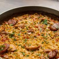Paella Valenciana · bomba rice simmered with chicken and chorizo
