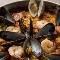Paella Mixta · bomba rice simmered with chicken, chorizo, mussels, shrimp, calamari, clams