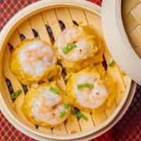 Shrimp Dumplings  · (4 pcs) Shrimp, chicken, garlic, scallions, and cilantro topped with scallions and fried gar...