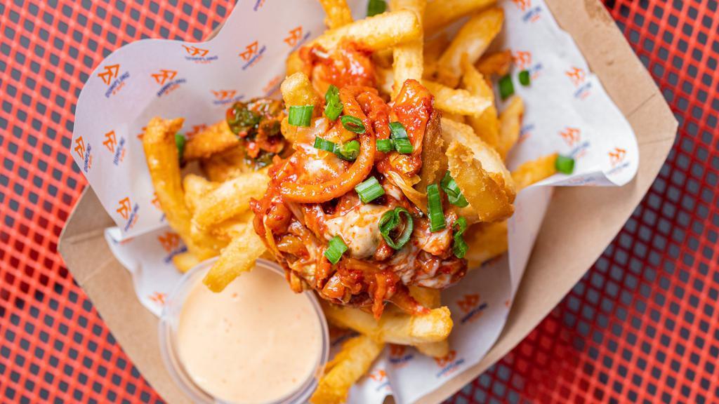 Kimchi Fries · Topped with spicy pickled cabbage and scallions served with spicy mayo.