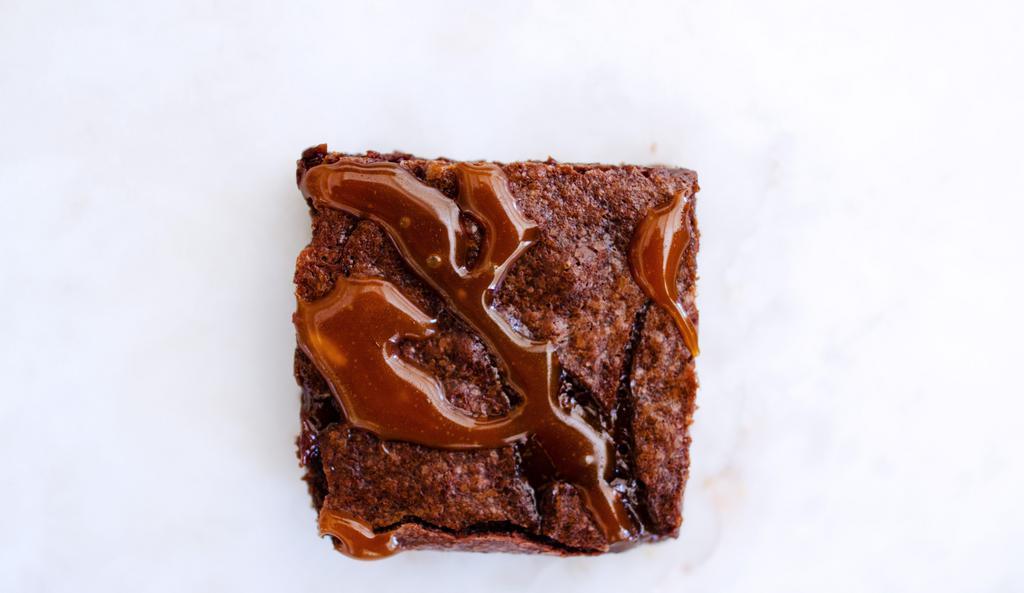Salted Caramel Brownies · Deep, chocolate brownies injected with a thick ribbon of gooey salted caramel, sure to satisfy your basest desires.