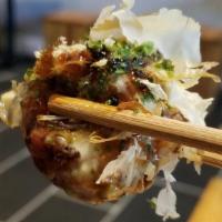 Takoyaki (Octopus Ball) · 4 Jumbo Octopus ball topped with sweet wasabi mayo, eel sauce, smoked tuna flakes and sprink...