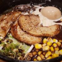 Tonkotsu  · Pork bone stock, thin straight  noodle. Full flavor creamy texture. topped  with 2 sliced gr...