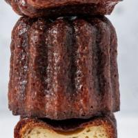 Canelé · A small French pastry flavored with rum and vanilla with a soft and tender custard center an...