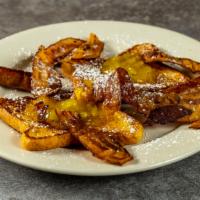 Golden Brown French Toast · Served with butter and syrup.