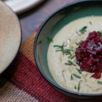 Hummus · Chickpeas spread with beetroot salsa and pickled za'atar.