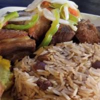 Fried Pork / Griot · Served with Rice & Peas