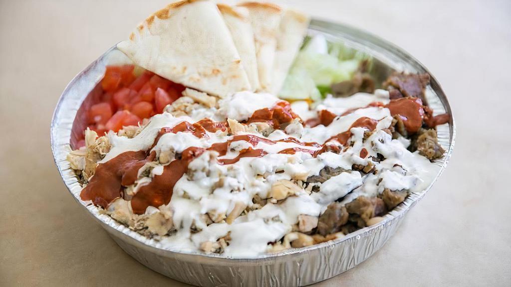 Gyro Platter · Served with lamb gyro, rice, lettuce, and tomatoes along with your choice of toppings and our famous white and hot sauce.