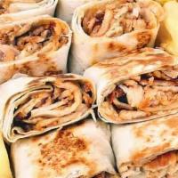 Chicken Shawarma  Sandwich · Warm pita bread filled with chicken. We add in lettuce, tomatoes, and top it off with our fa...