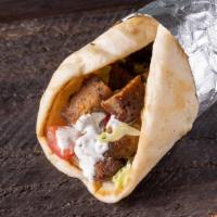 Gyro Sandwich · Warm pita bread filled with lamb gyro. We add in lettuce, tomatoes, and top it off with our ...