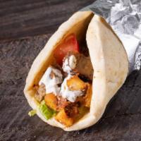Mixed Gyro Sandwich · Warm pita bread filled with a pairing of lamb gyro and chicken. We add in lettuce, tomatoes,...