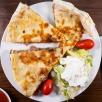 Quesadilla Rellena Lunch · A grilled flour tortilla filled with choice of chicken or ground beef and melted cheese, ser...