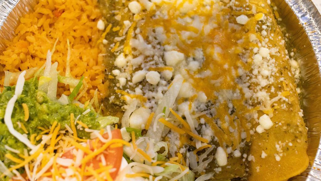 Enchiladas Verdes · Three chicken enchiladas topped with green avocado salsa and fresh Mexican cheese. Served with rice and guacamole salad.