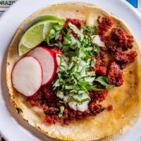 Chorizo Taco (Order Of 3) · Mexican sausage. Taco topped with onions and cilantro, garnished with lime wedge and radish,...