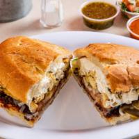 Chicken Torta · Mexican sausage, served on the telera toasted bread, coated with refried beans, mayonnaise, ...
