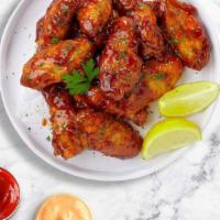 Sweet N' Smokin' Wings  · Fresh chicken wings breaded, fried until golden brown, and tossed in honey and barbecue sauc...