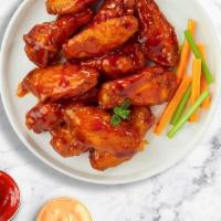 Red Matador Wings  · Fresh chicken wings breaded, fried until golden brown, and tossed in buffalo sauce. Served w...