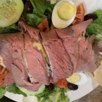 Chef Salad · Crisp iceberg lettuce, sliced breast of turkey, roast beef, boiled ham, swiss cheese, cucumb...