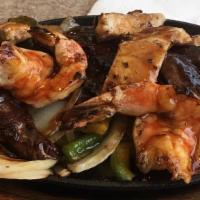 Shrimp Fajita · A sizzling dish With marinated shrimp in teriyaki sauce, served on top of mixed onions and p...