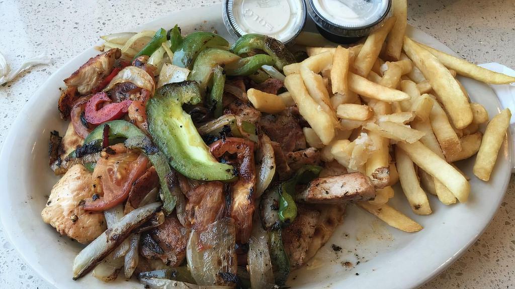 Souvlaki Platter · Your choice of chicken or pork With tomato, peppers, onions and tzatziki on pita bread, served With French fries or a small Greek salad.