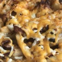 Ultimate Fries · French fries with melted mozzarella and cheddar Cheese smothered With Bacon bits and sour cr...