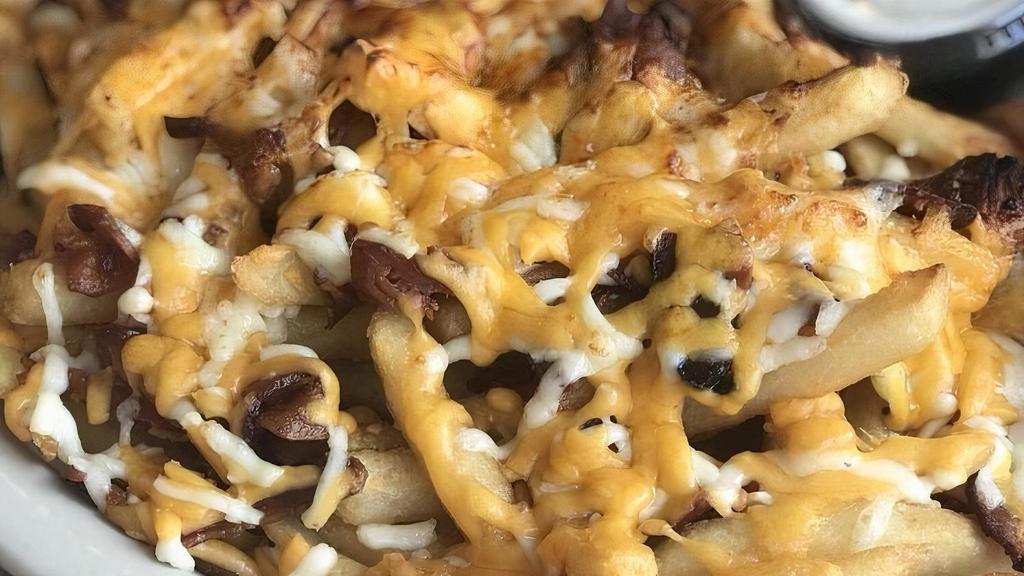 Ultimate Fries · French fries with melted mozzarella and cheddar Cheese smothered With Bacon bits and sour cream on the side.