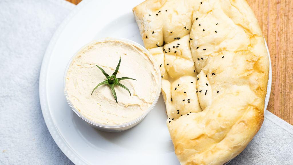 Hummus · Vegetarian, vegan, dairy free, gluten free. Levantine dip made from cooked, pureed chickpeas, blended with tahini, extra virgin olive oil, lemon juice, garlic, salt and spices.