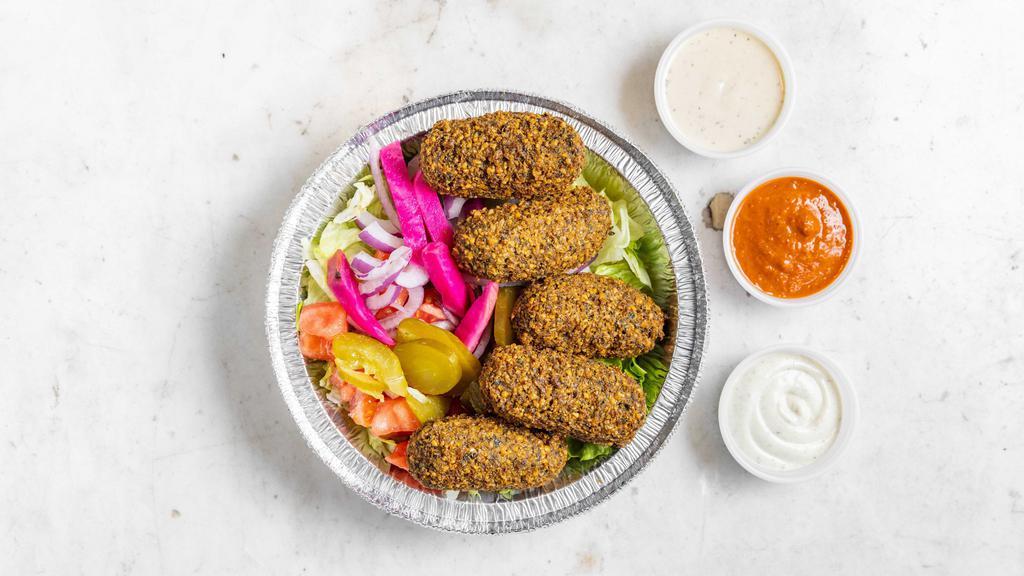 Falafel · What made us famous! Our original blend of chickpeas, onion, garlic, parsley, and my mom's secret spices ground together and deep fried in vegetable oil in an oval shape.