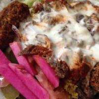 Freddy Junior · A combination of charbroiled kefta and chicken, over rice and salad, with tahini sauce and a...