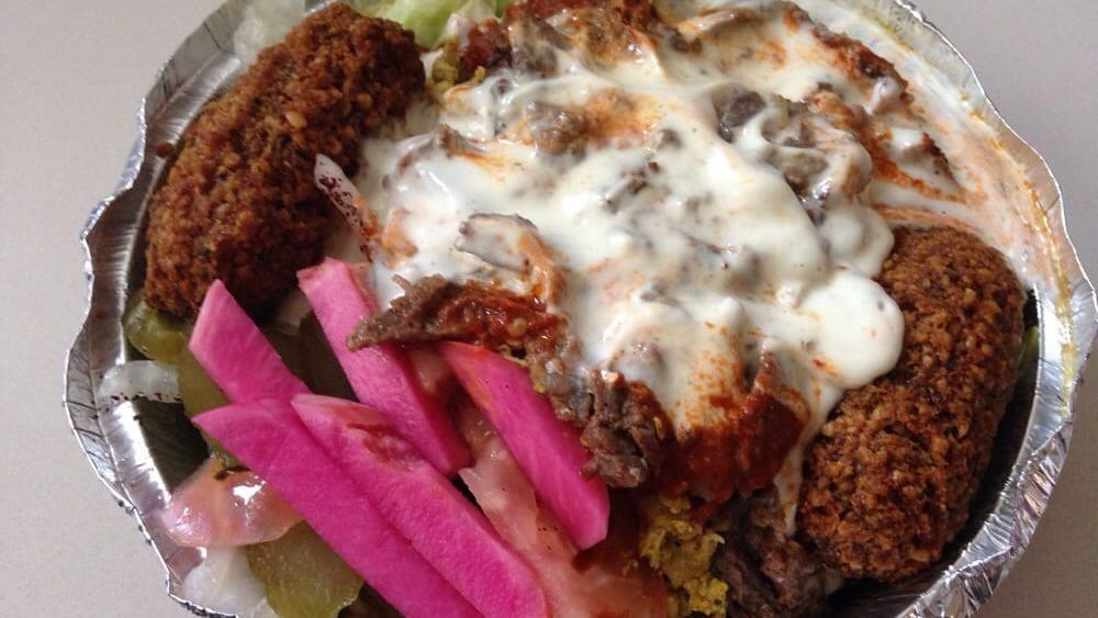Freddy Junior · A combination of charbroiled kefta and chicken, over rice and salad, with tahini sauce and a splash of hot Ouch Baby!