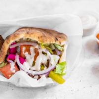 Falafel · A vegan heaven our famous falafel stuffed in our fresh pita with our house salad and tahini ...