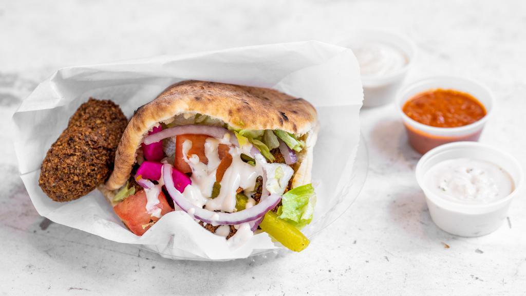 Falafel · A vegan heaven our famous falafel stuffed in our fresh pita with our house salad and tahini sauce.