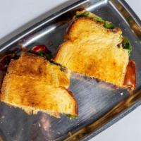 Beef Sandwich · Braised short rib with horseradish sauce, arugula and cherry tomatoes on challah bread.